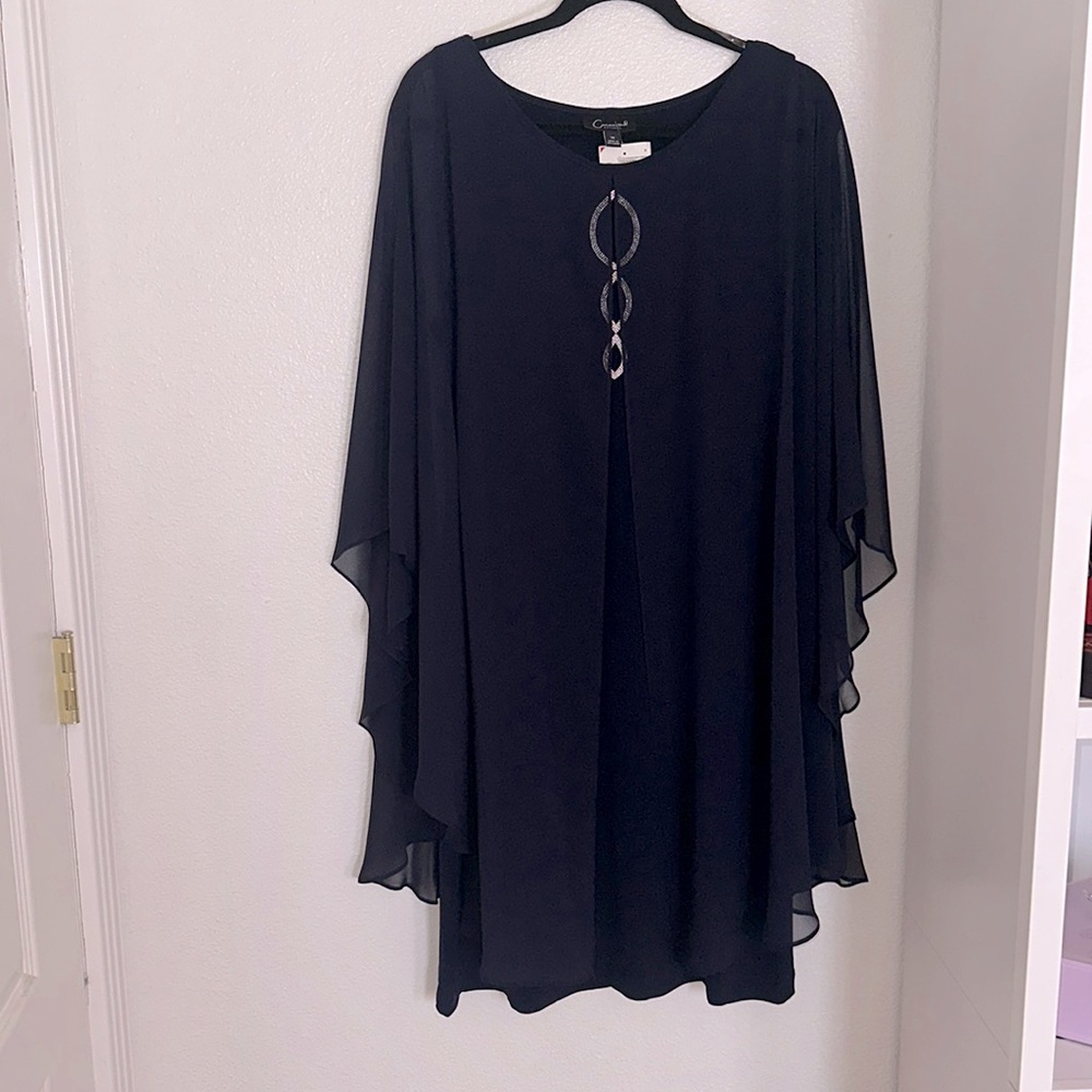 Navy blue mid length formal gown with sheer cape, draping around front and back